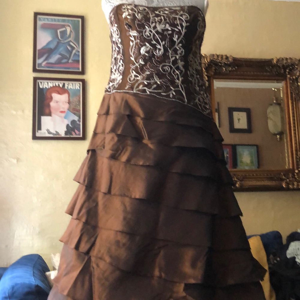 Strapless evening gown with long sleeved shrug